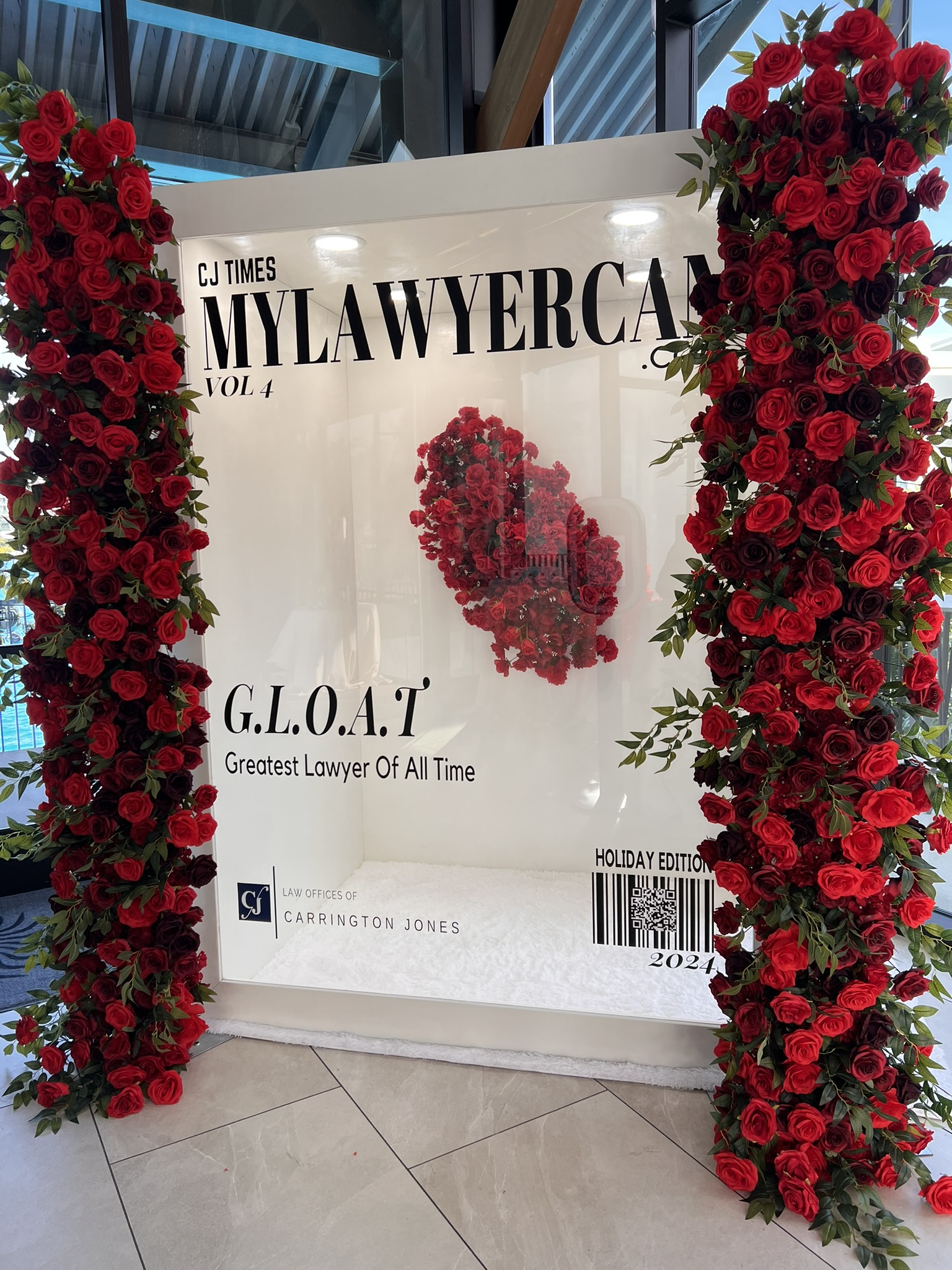 BLux Magazine Photo Experience with a red floral event backdrop