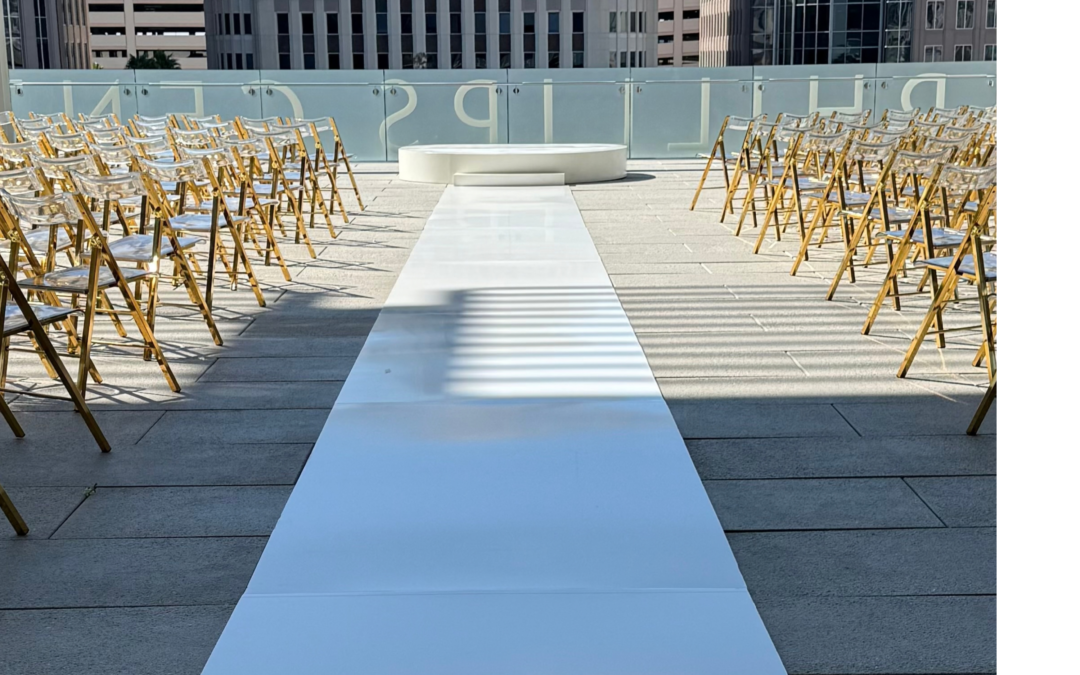 BLux ceremony with guest seating, aisle runner, and stage in Orlando