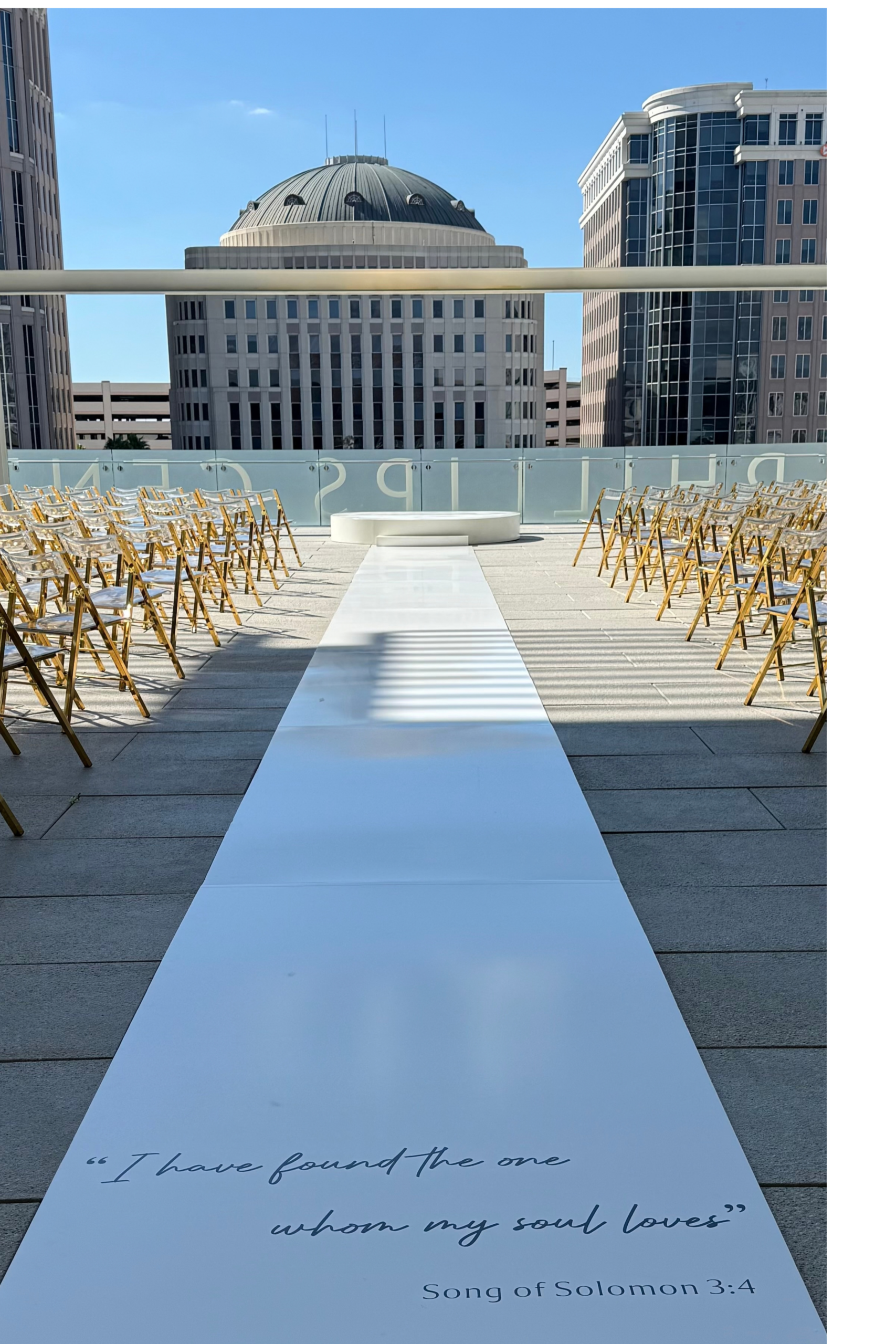 BLux luxury ceremony with seating, aisle runner, stage, and floral design in Orlando