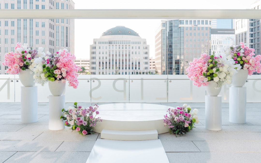 BLux wedding ceremony with white aisle runner and stage in Orlando